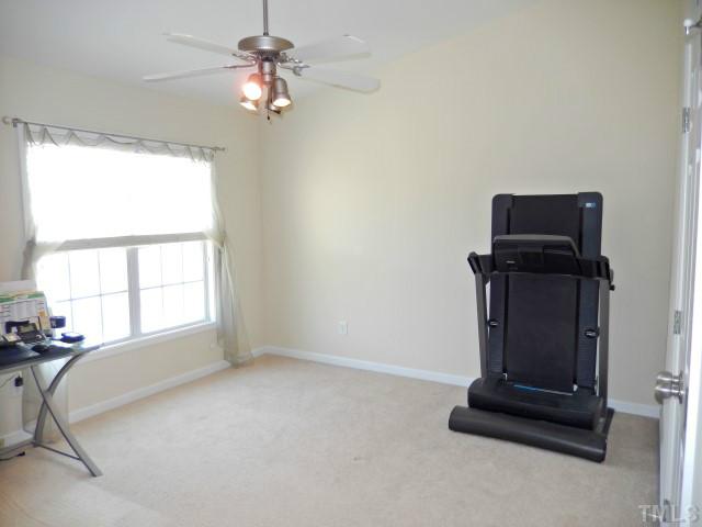 2131 Piney Brook Road, Unit 106 Raleigh, NC 27614 - Photo 10 of 23 a living room with furniture and a window