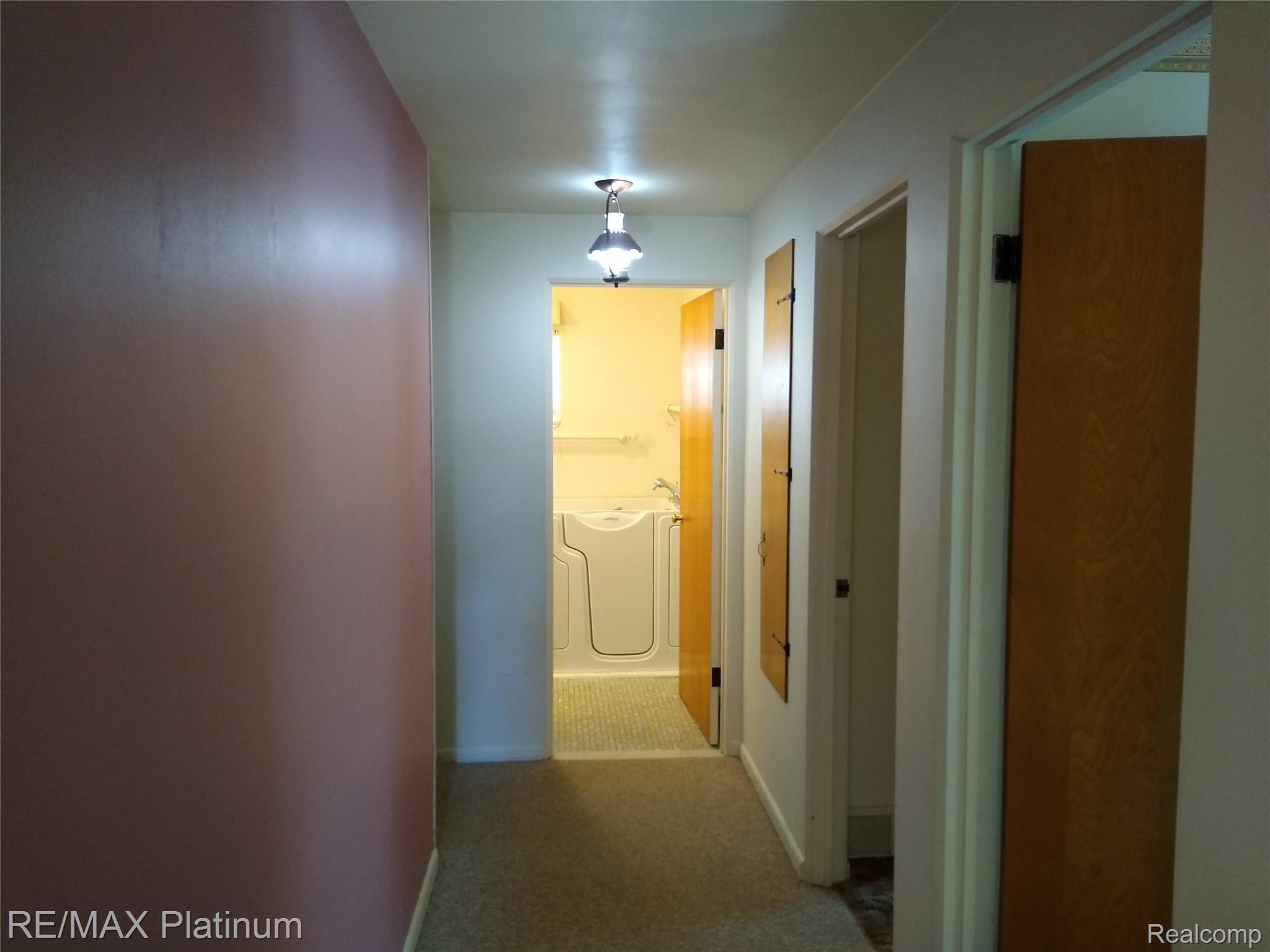 1555 Chilson Road Howell, MI 48843 - Photo 19 of 47 Hallway to bedrooms and bath