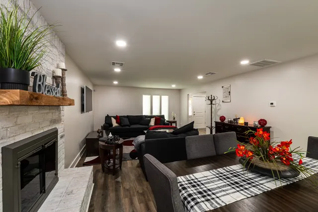 a living room with furniture and a fireplace