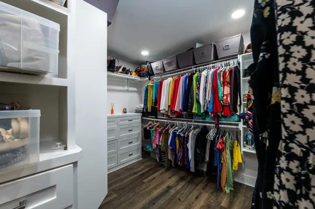 a bed room with furniture and a flat screen tv