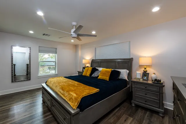 a bathroom with a sink mirror and toilet