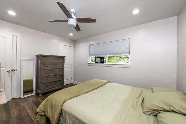 a view of a hallway with a white car parked in a room
