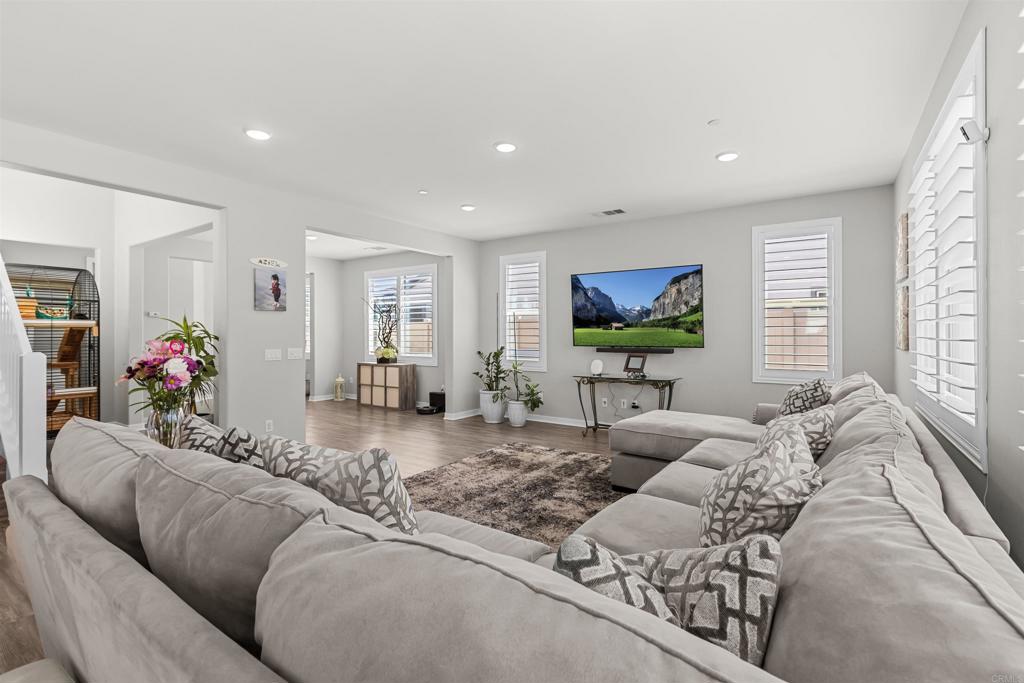 29809 Gypsy Vanner Way Menifee, CA 92584 - Photo 14 of 45 a living room with furniture and a flat screen tv