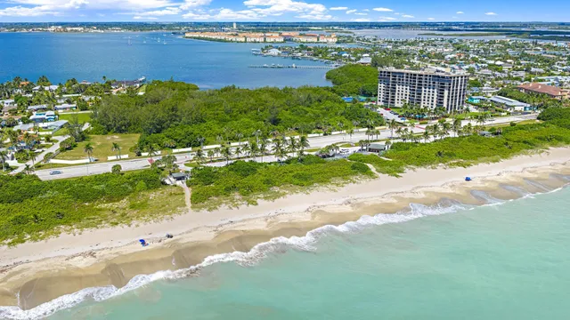 an aerial view of a house with a lake view