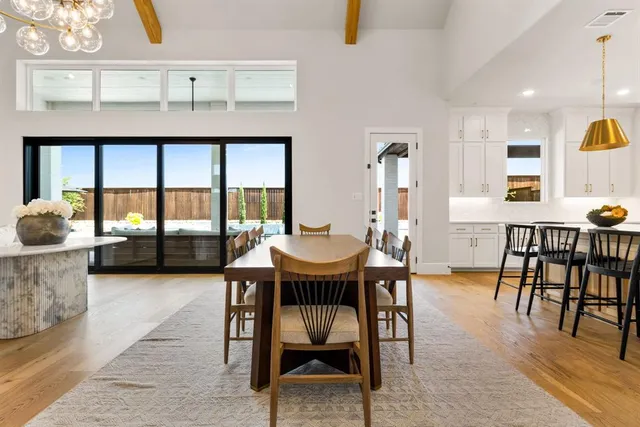 a view of a dining room with furniture and window