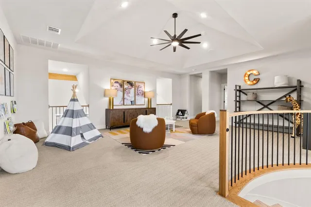 a bedroom with furniture and a large window