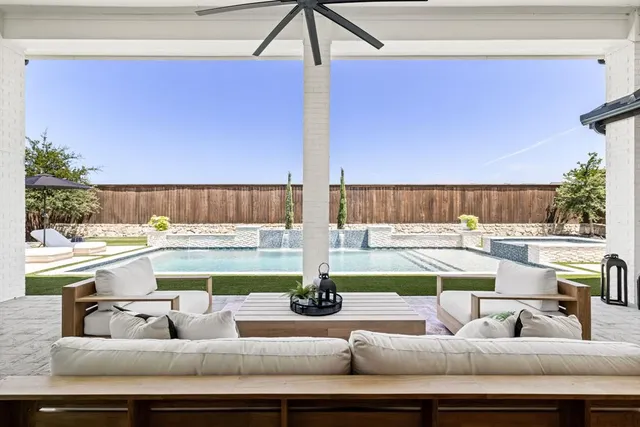 a view of a living room and kitchen with couches