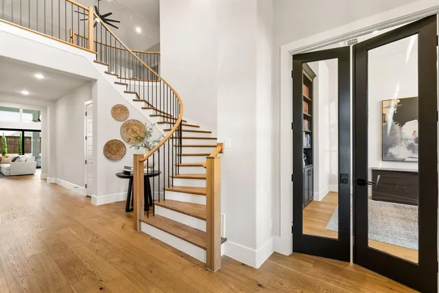 a view of entryway and hall with wooden floor