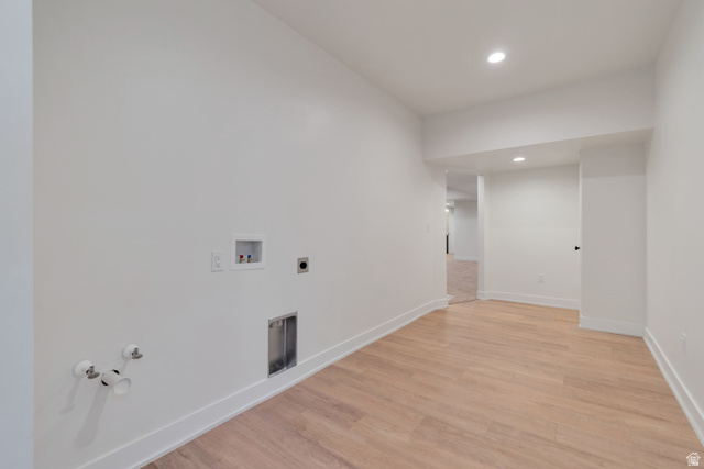 1820 West Farmhouse Flats Road Peoa, UT 84061 - Photo 37 of 79 Spacious utility area featuring wood-finish flooring, recessed lighting, crisp white walls, white baseboards, and pre-installed laundry connections