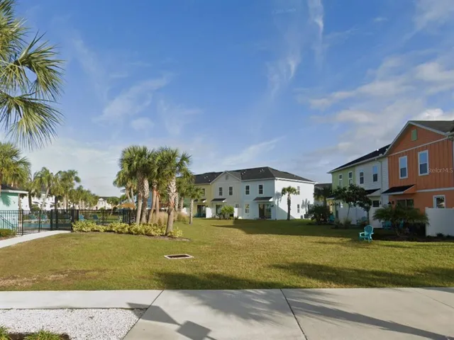a front view of a building with a garden