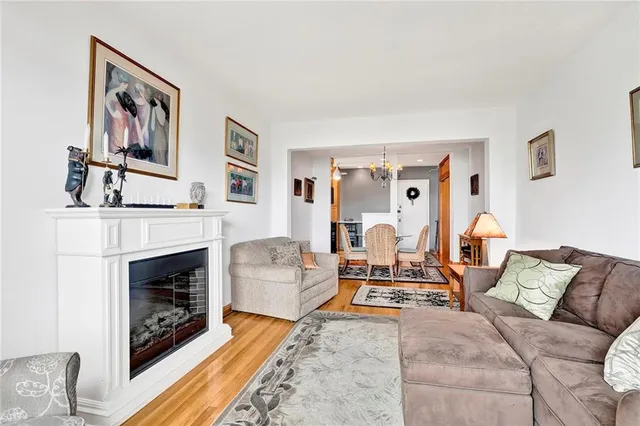 a living room with furniture fireplace and rug