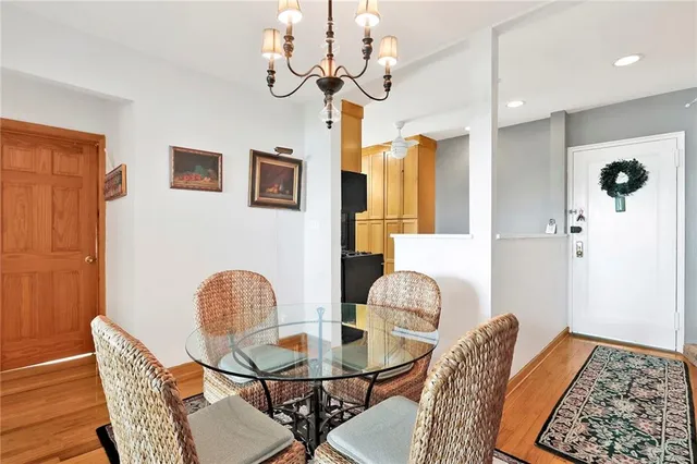 a dining room with furniture and chandelier