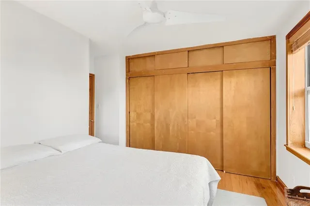 a bed room with a bed and a shower