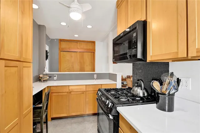 a kitchen with a stove and a microwave