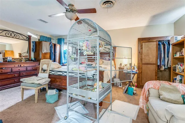 a living room with fireplace furniture and a large window