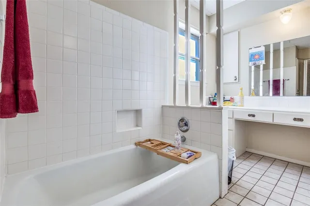 a bathroom with a bathtub and a sink