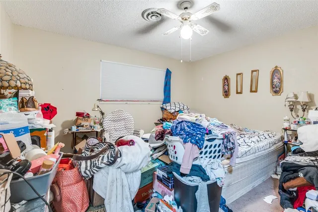 a bedroom with furniture and a chandelier