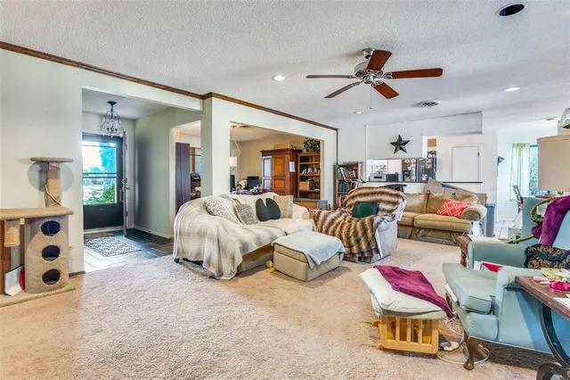 a bedroom with furniture and a chandelier