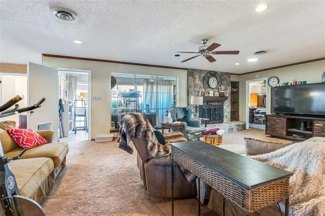 a outdoor living space with furniture and a flat screen tv