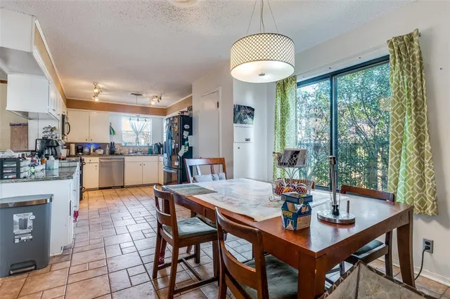 a view of a dining room with furniture window and outside view