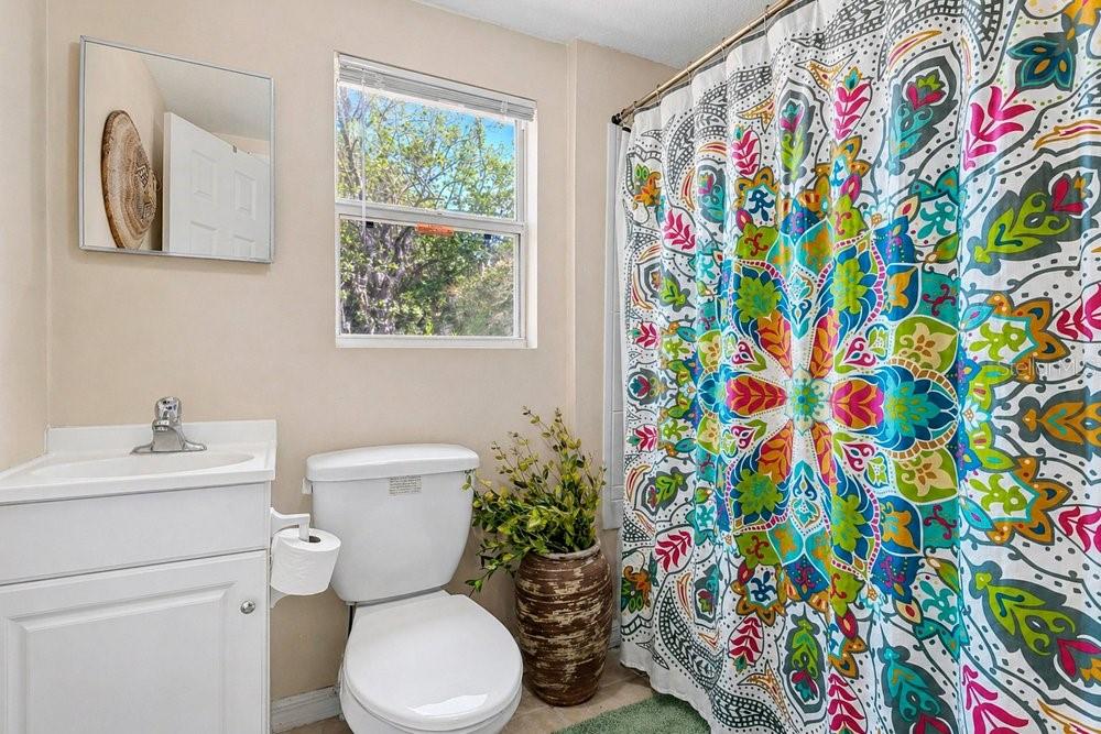 595 3rd Street Oviedo, FL 32765 - Photo 16 of 27 a bathroom with a toilet sink and mirror