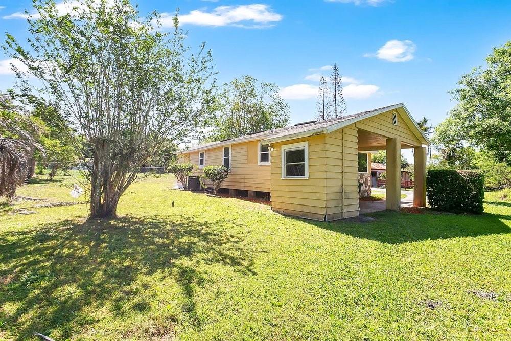 595 3rd Street Oviedo, FL 32765 - Photo 18 of 27 a view of a house with a yard