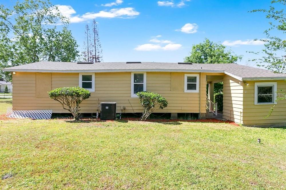 595 3rd Street Oviedo, FL 32765 - Photo 19 of 27 a view of a house with pool in front of it