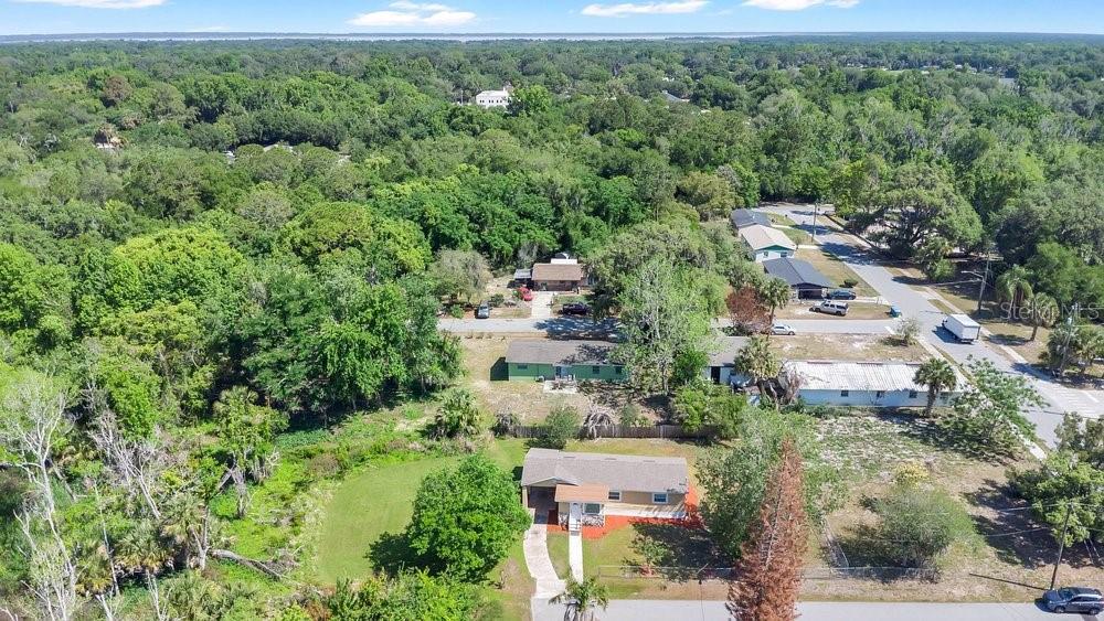 595 3rd Street Oviedo, FL 32765 - Photo 21 of 27 an aerial view of residential house with outdoor space and trees all around