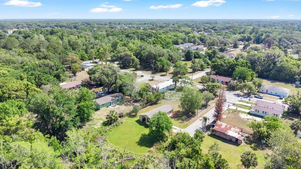 595 3rd Street Oviedo, FL 32765 - Photo 23 of 27 an aerial view of residential houses with outdoor space and trees