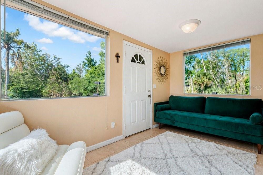 595 3rd Street Oviedo, FL 32765 - Photo 4 of 27 a living room with furniture and a large window