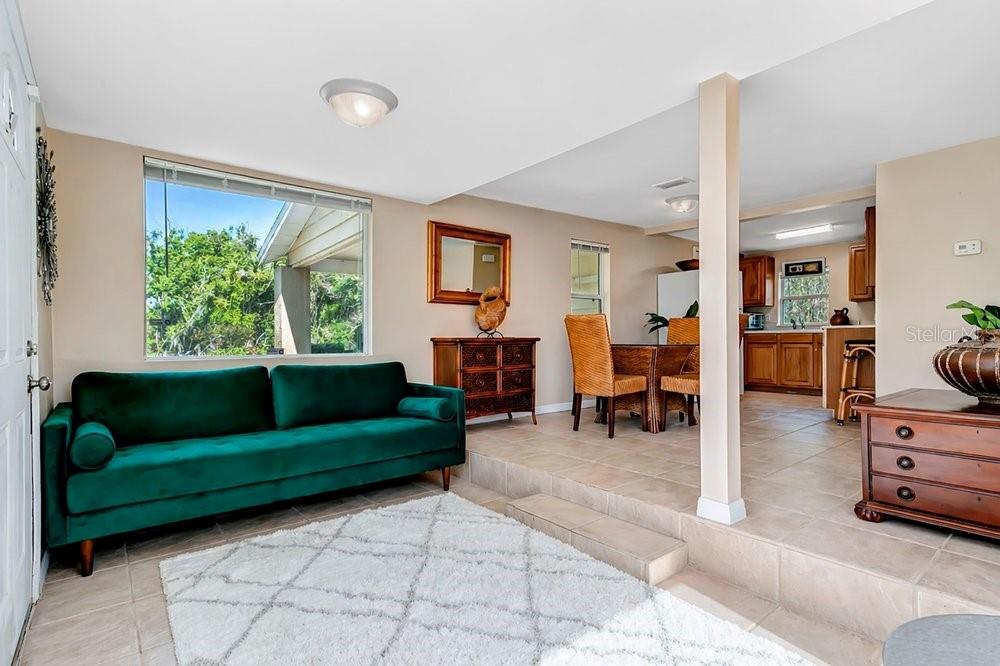 595 3rd Street Oviedo, FL 32765 - Photo 6 of 27 a living room with furniture and a large window