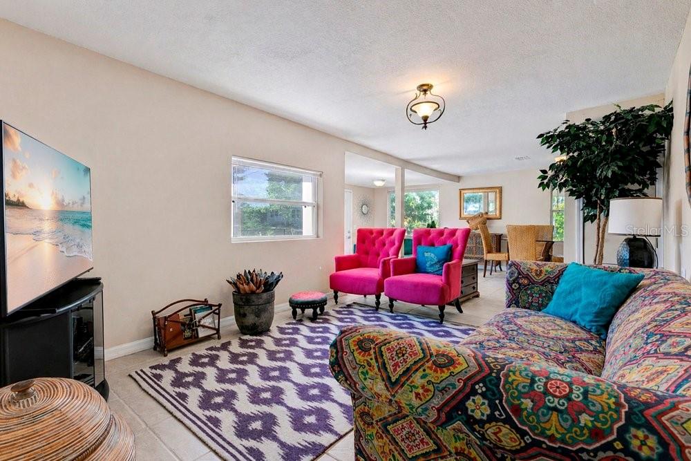 595 3rd Street Oviedo, FL 32765 - Photo 8 of 27 a living room with furniture a flat screen tv and a fireplace