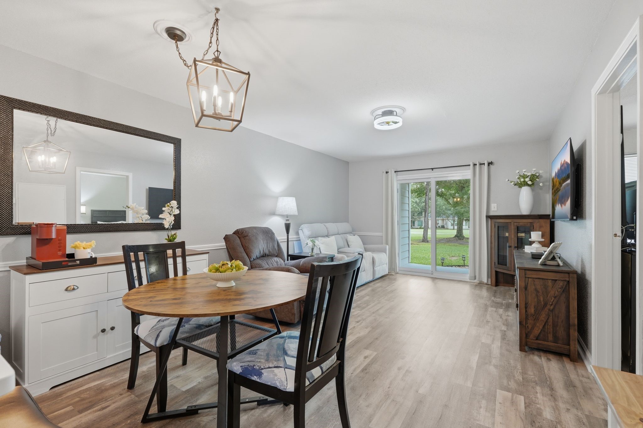 13151 Walden Road, Unit 131 Montgomery, TX 77356 - Photo 4 of 35 Dining area filled with natural light and views of the outdoor patio.