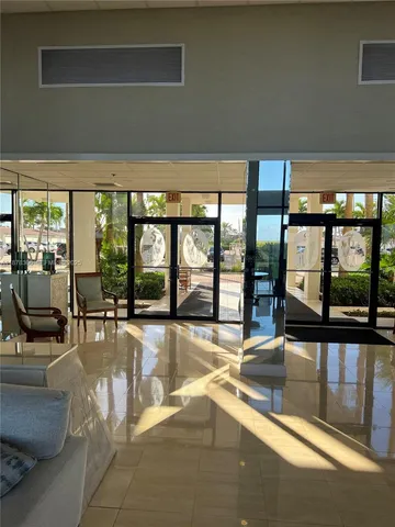 a room with gym equipment and a flat screen tv