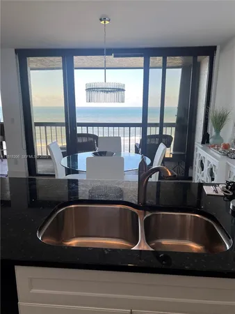 a view of kitchen and dining area with furniture