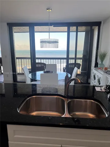 a view of kitchen and dining area with furniture