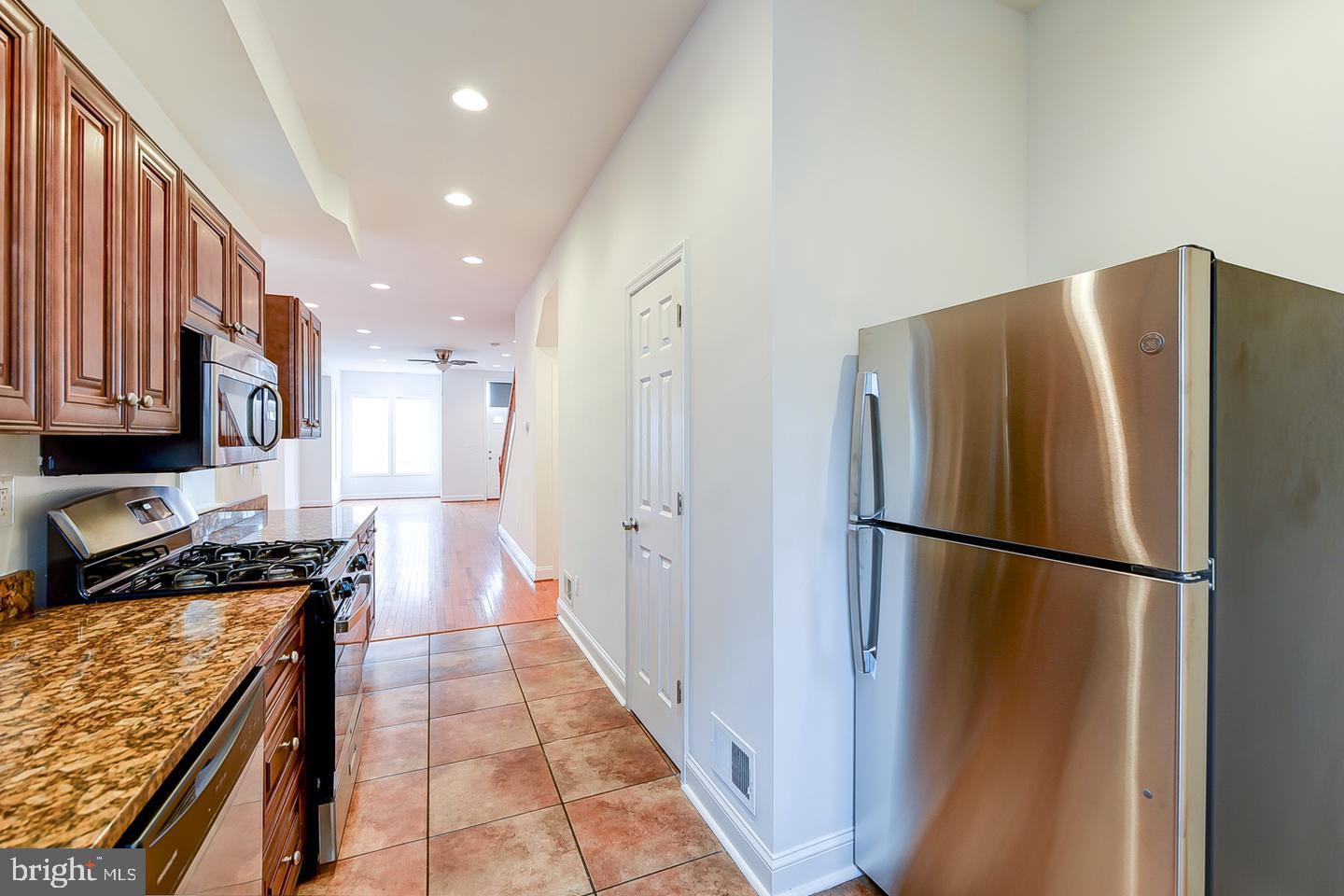 14 Florida Avenue Northeast Washington, DC 20002 - Photo 12 of 31 a kitchen with stainless steel appliances granite countertop a refrigerator and a stove
