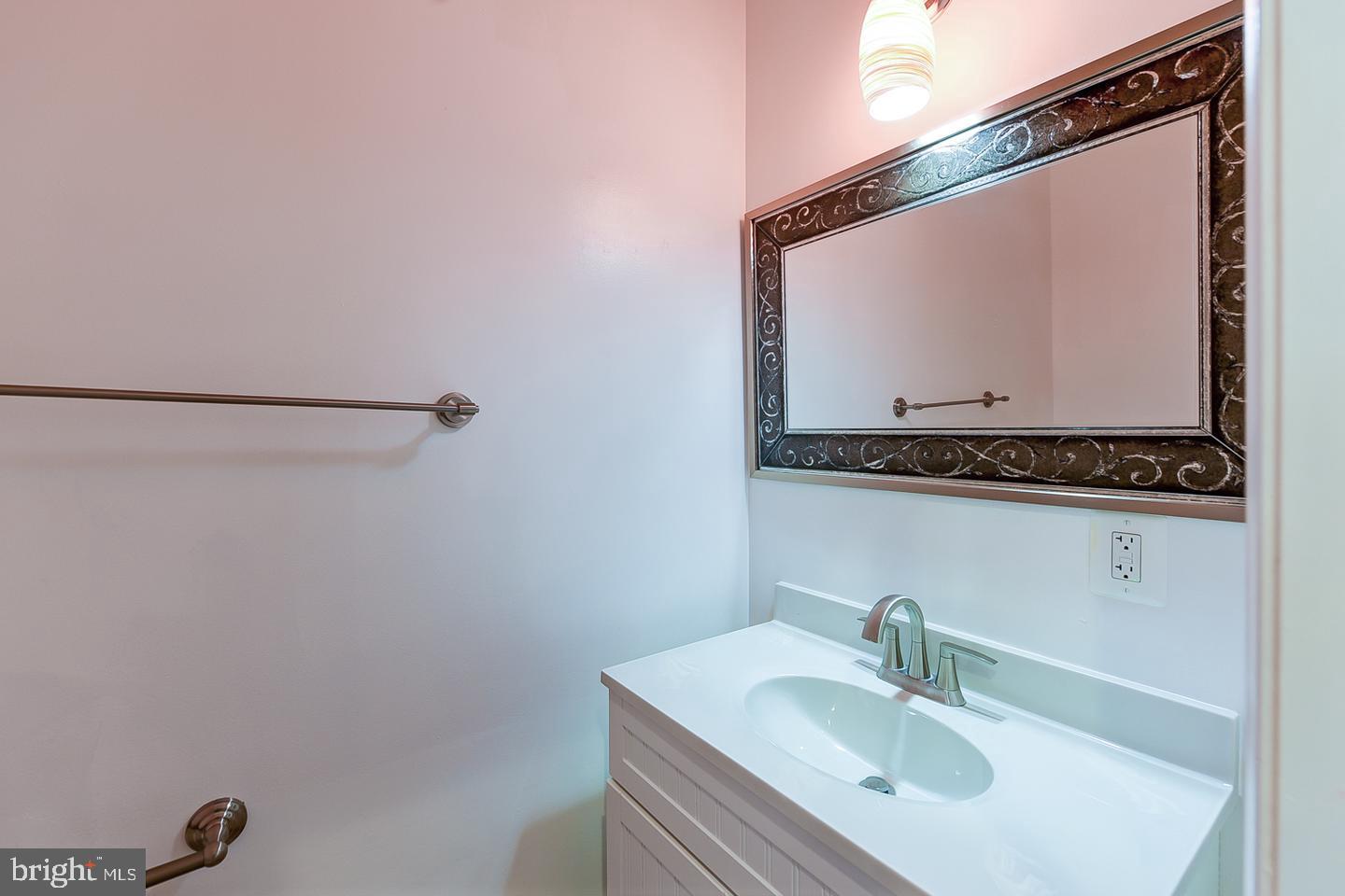 14 Florida Avenue Northeast Washington, DC 20002 - Photo 13 of 31 a bathroom with a sink and a mirror