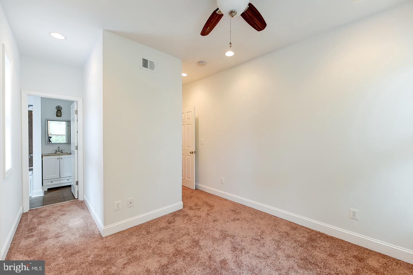 14 Florida Avenue Northeast Washington, DC 20002 - Photo 16 of 31 an empty room with closet and windows