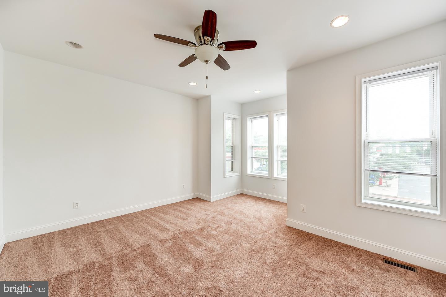 14 Florida Avenue Northeast Washington, DC 20002 - Photo 18 of 31 wooden floor in an empty room with a window