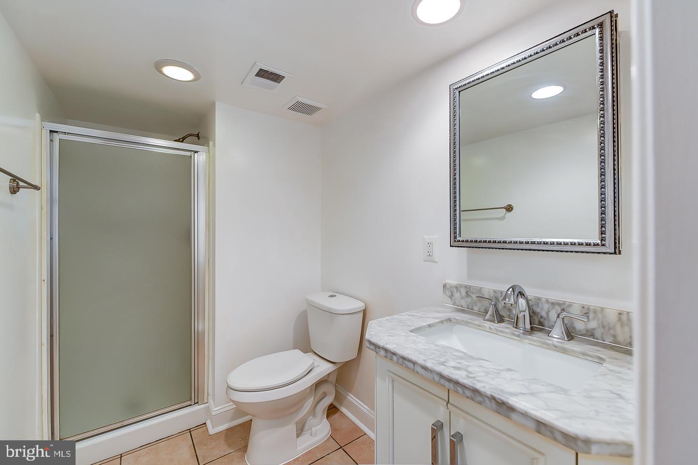 14 Florida Avenue Northeast Washington, DC 20002 - Photo 27 of 31 a bathroom with a granite countertop sink toilet and shower