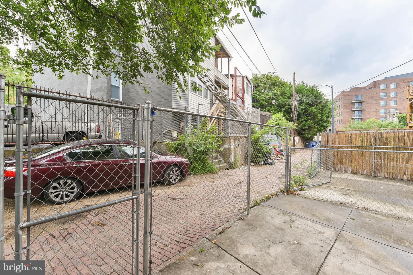 14 Florida Avenue Northeast Washington, DC 20002 - Photo 30 of 31 a view of a street with potted plants