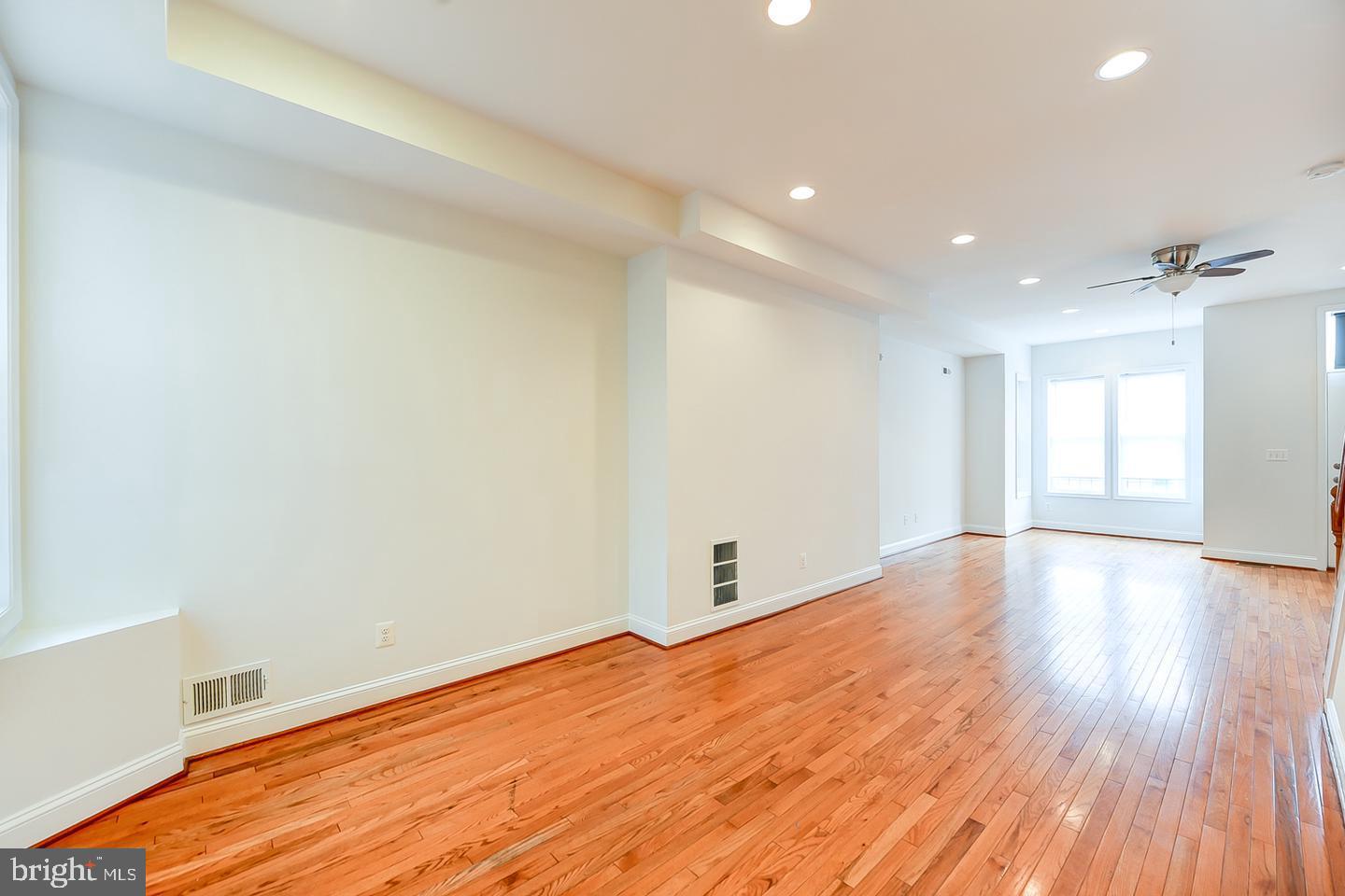 14 Florida Avenue Northeast Washington, DC 20002 - Photo 7 of 31 a view of empty room with wooden floor and fan