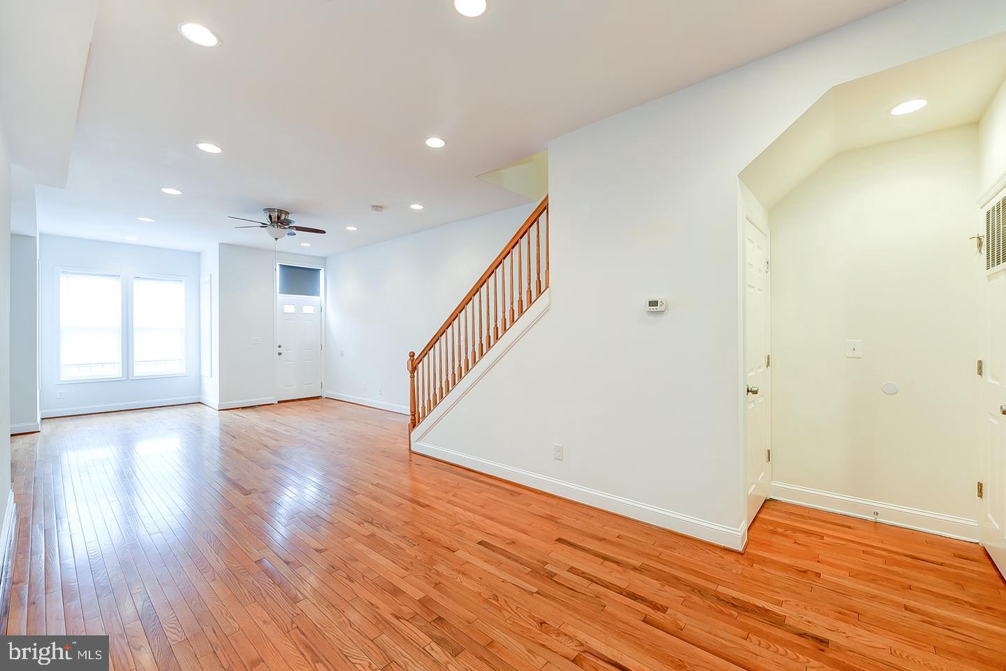 14 Florida Avenue Northeast Washington, DC 20002 - Photo 8 of 31 a view of an empty room with wooden floor and a window