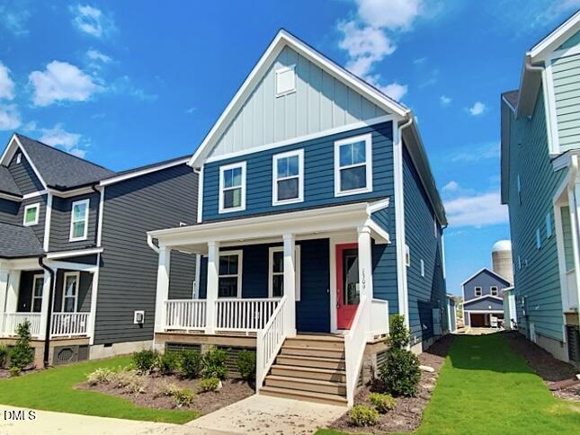 1309 Holding Village Way Wake Forest, NC 27587 - Photo 1 of 28 a front view of a house with a yard