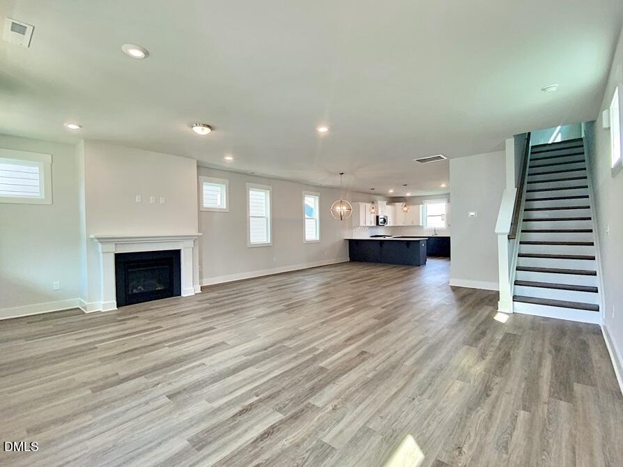 1309 Holding Village Way Wake Forest, NC 27587 - Photo 2 of 28 a view of kitchen and hall with wooden floor