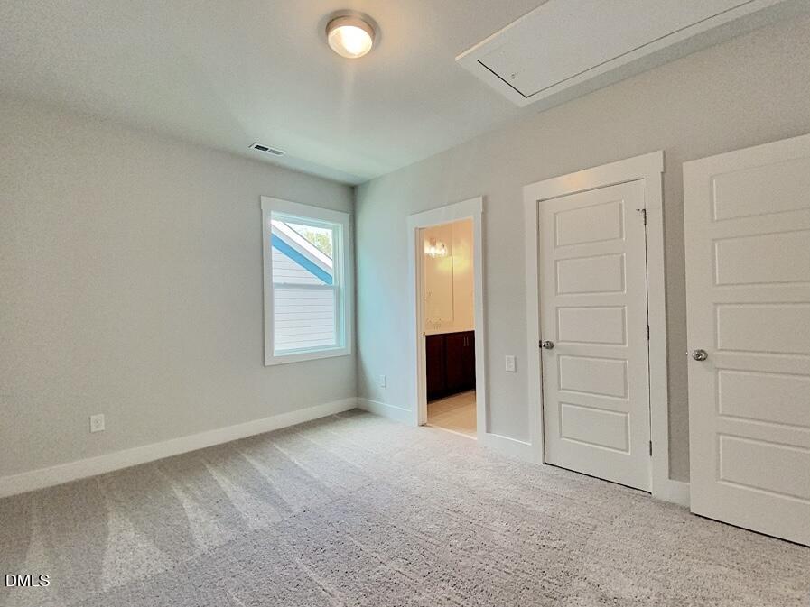 1309 Holding Village Way Wake Forest, NC 27587 - Photo 22 of 28 an empty room with windows and closet