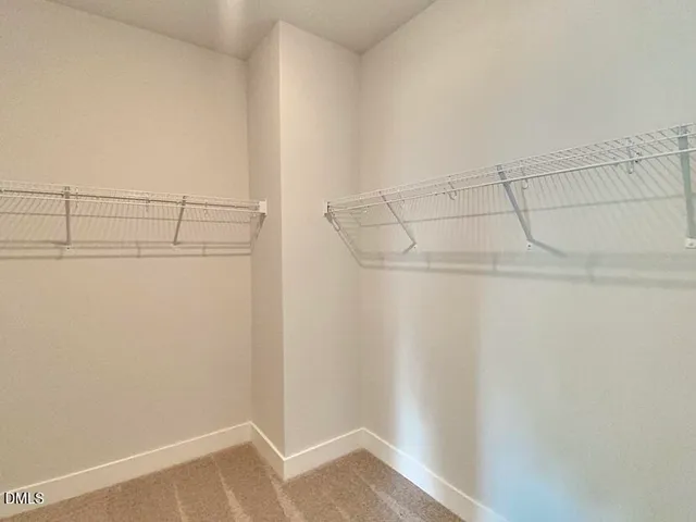 a bathroom with a sink a toilet a shower and a mirror