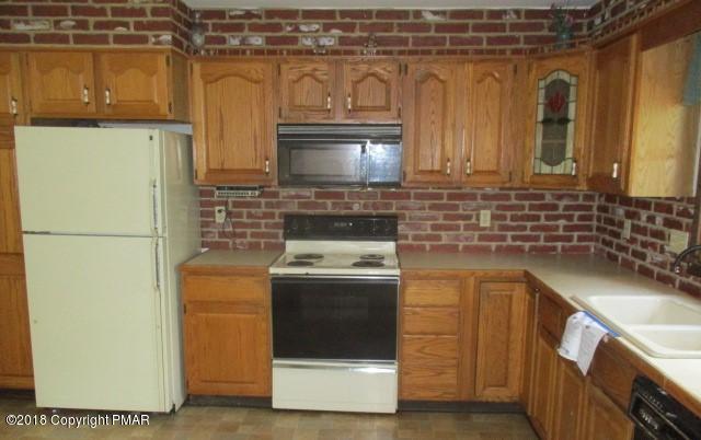 2817 Jackson Road Stroudsburg, PA 18360 - Photo 12 of 22 a kitchen with a sink stove and refrigerator