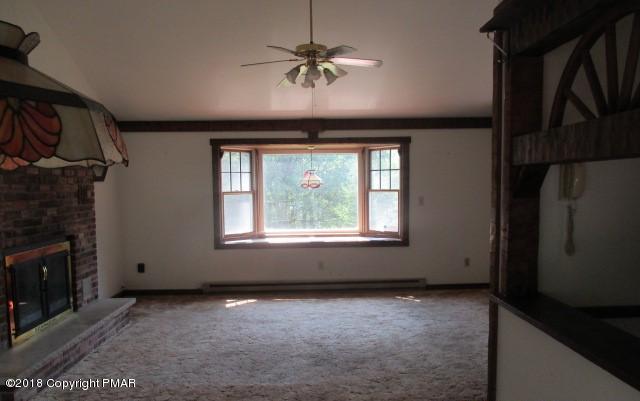 2817 Jackson Road Stroudsburg, PA 18360 - Photo 8 of 22 an empty room with windows and fan